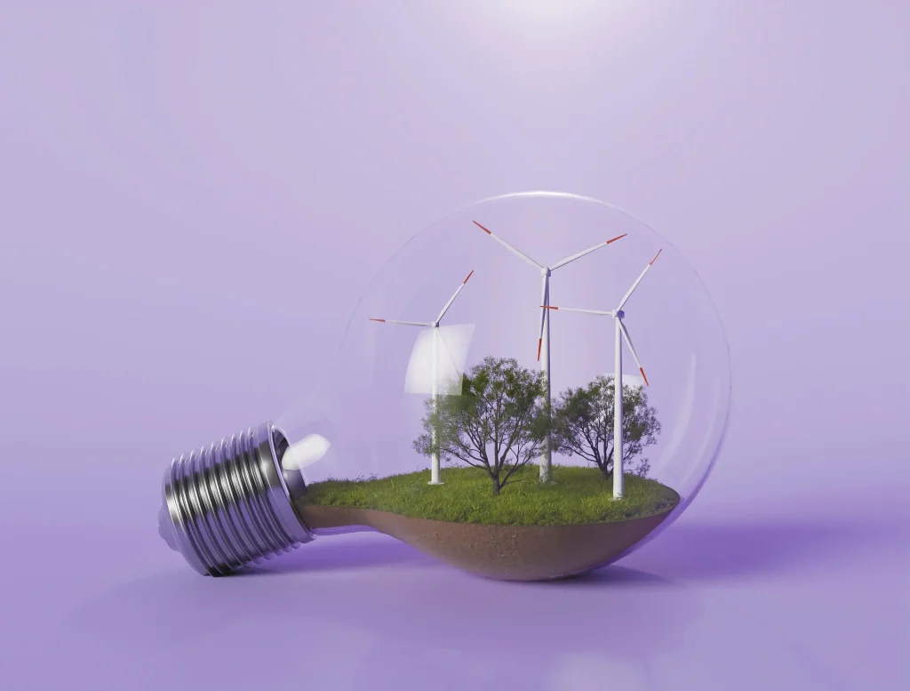 Imagem de uma lâmpada com objetos dentro que simbolizam a energia eólica e a natureza, evidenciando a necessidade de promover a energia limpa